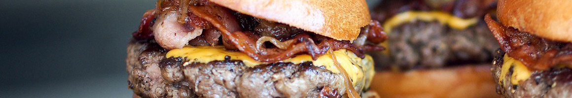 Eating American (Traditional) Burger at Graze Premium Burgers restaurant in Tucson, AZ.